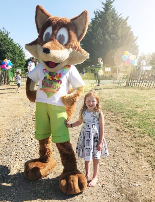 felix the park mascot and little girl