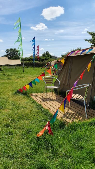 Canvas tents and coloured festival flags