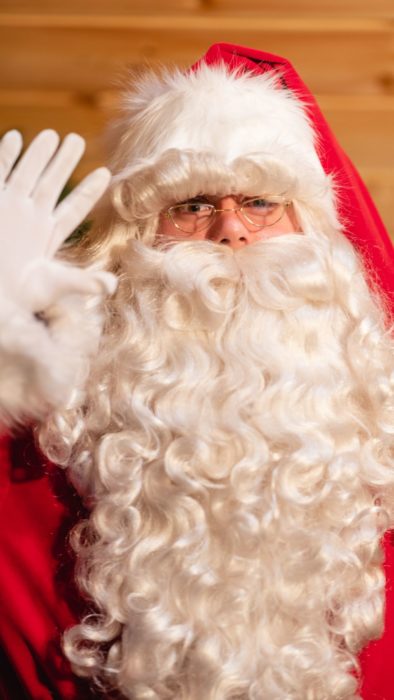 Father Christmas waving to camera
